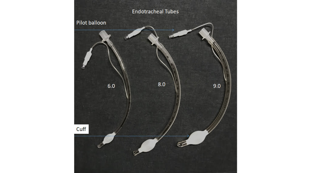 The image shows three endotracheal tubes on a black background.