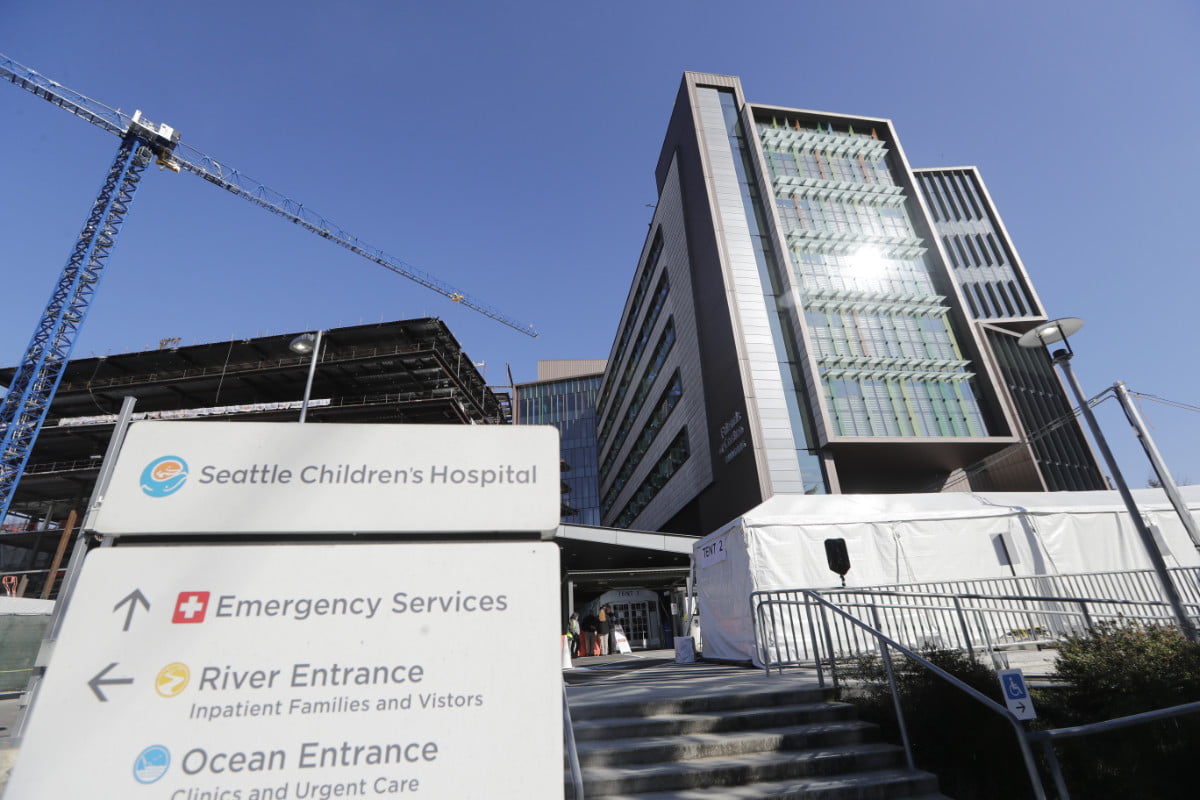 A sign stands outside Seattle Children's Hospital on March 18, 2020.