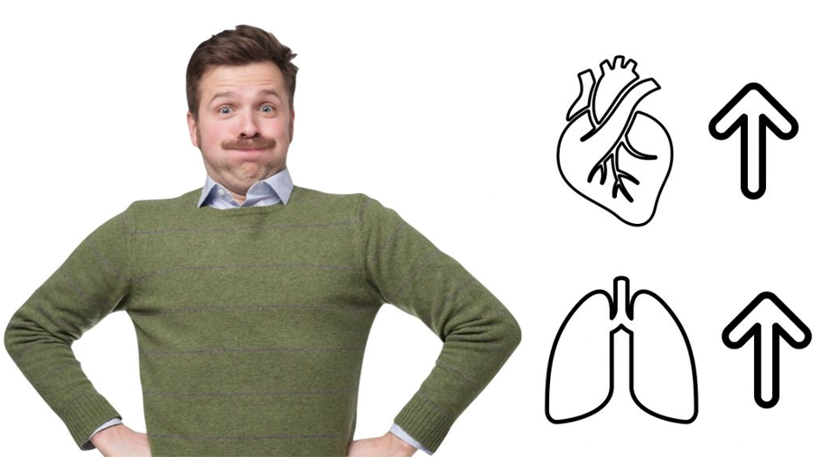 A man with a moustache has his arms on his hips while wearing a green sweater. Next to him is a graphic for heart and lungs with two arrows facing up. 