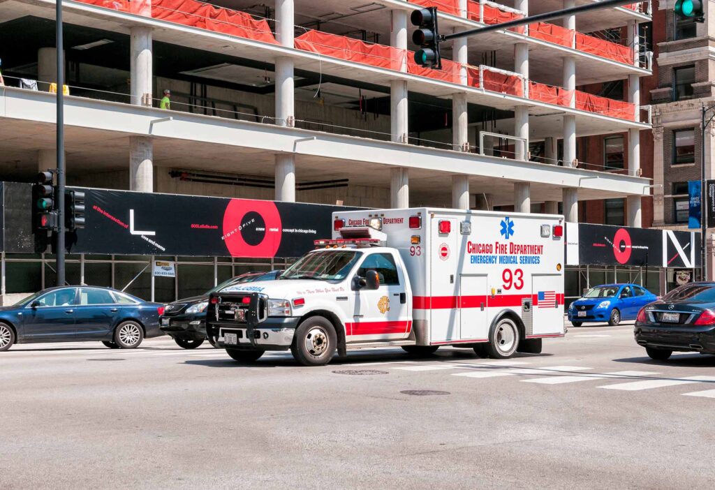 Ambulance of Chicago Fire Department on the road in the Chicago Downtown.