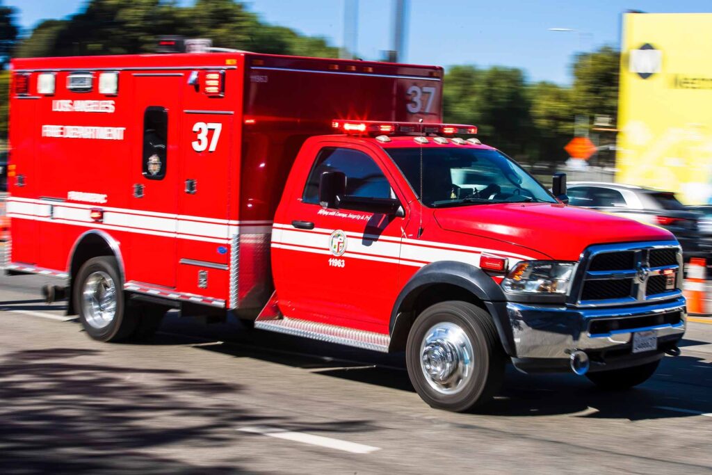 Blurred motion of a Los Angeles Fire Department ambulance speeding through the city.